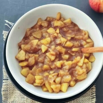 Homemade apple pie filling which is cinnamon apples made with fresh apple slices, sugar, and cinnamon for an easy breakfast topping.