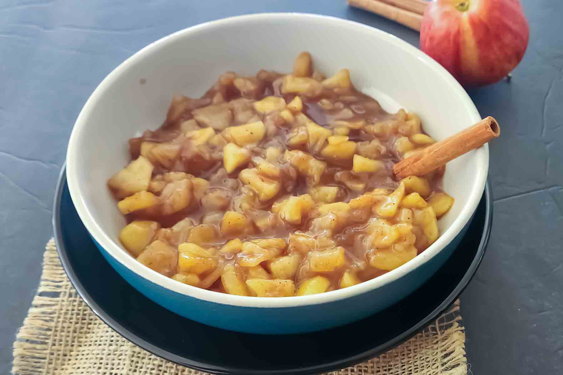 Tender cinnamon sugar apples served in a bowl, a simple apple dessert topping for pancakes, oatmeal, waffles, and ice cream.