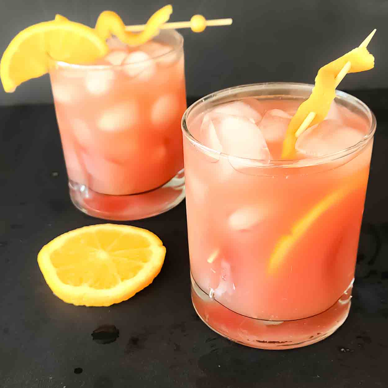 This Cranberry Orange Mocktail Recipe is refreshing, fizzy, and made with just 4 simple ingredients: cranberry juice, orange juice, lemon juice, and ginger ale! Ready in just 5 minutes, this beautiful non-alcoholic cranberry drink is perfect for Christmas, Thanksgiving, Diwali, holiday parties, and family gatherings. 