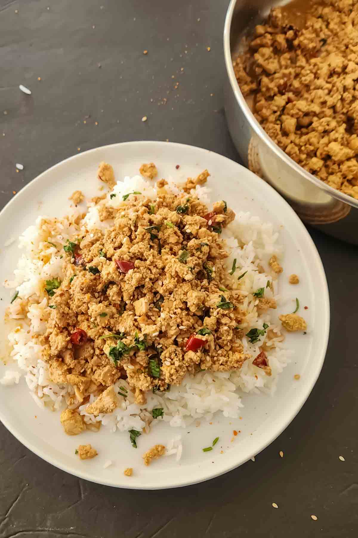 Minced tofu with chili scrip sauce served over rice for easy vegan and gluten-free plant based dinner.