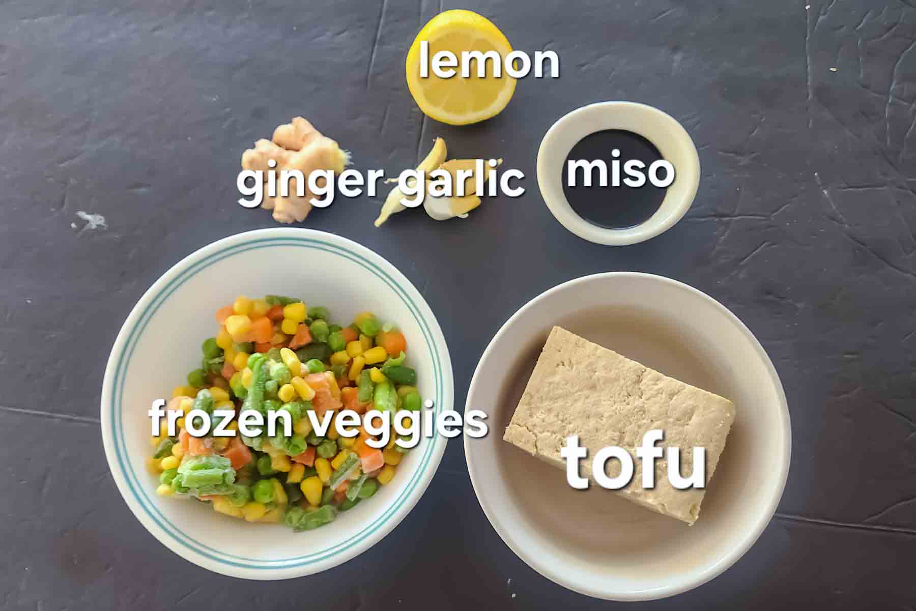 Easy ingredients used in making vegan tofu miso soup with frozen vegetables.